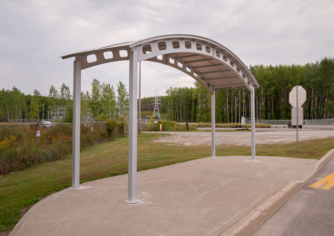 View of a bus shelter with polycarbonate roof